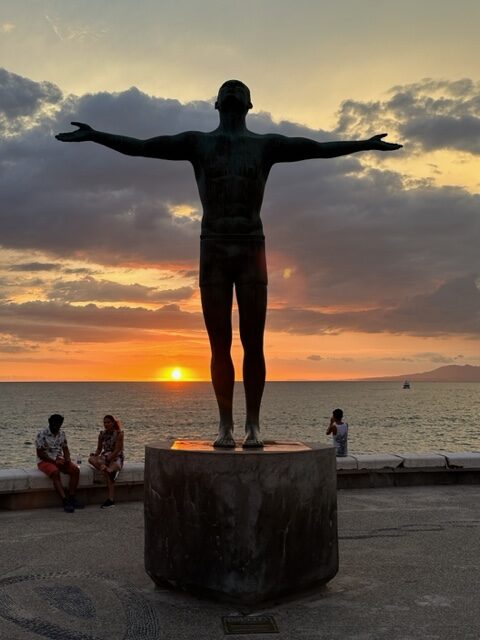 The Boy on the Seahorse sculpture at sunset on Puerto Vallarta’s Malecón
