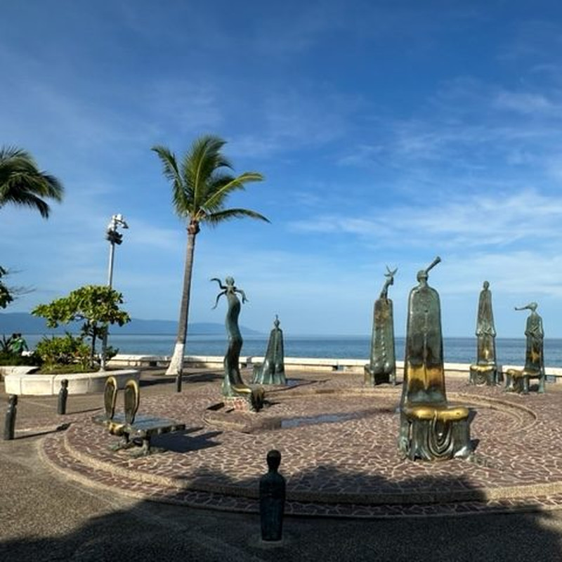 Bronze sculptures along the Puerto Vallarta malecón facing the bay