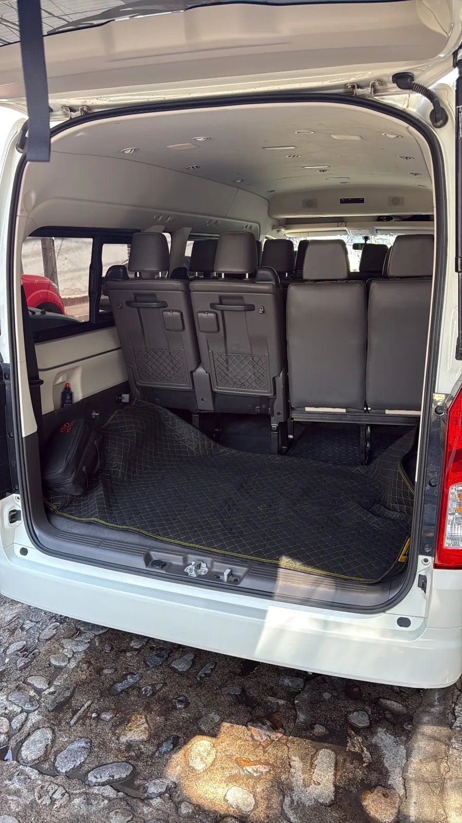 Spacious private van interior with passenger seating and luggage room
