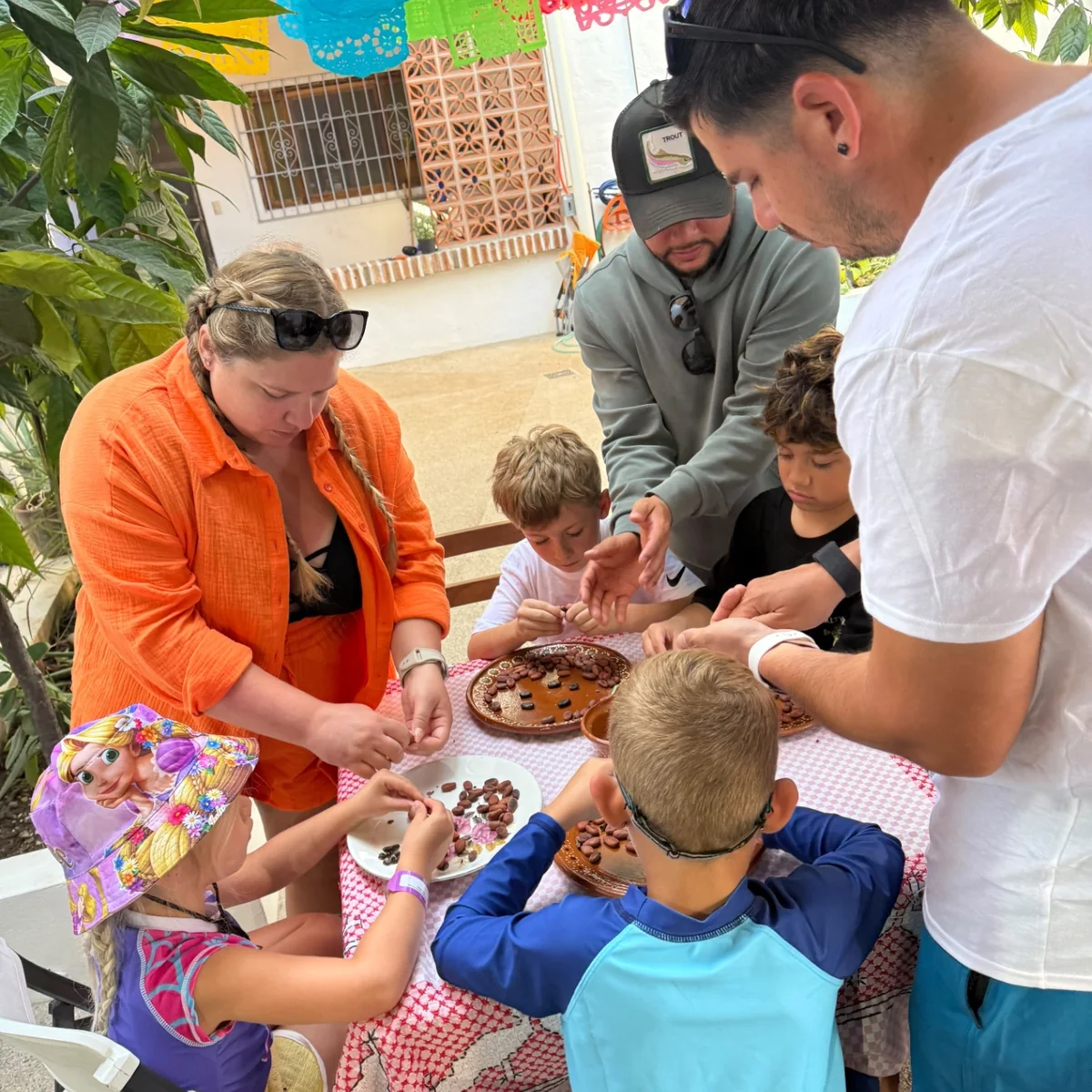Children and adults taking part in an artisan chocolate experience