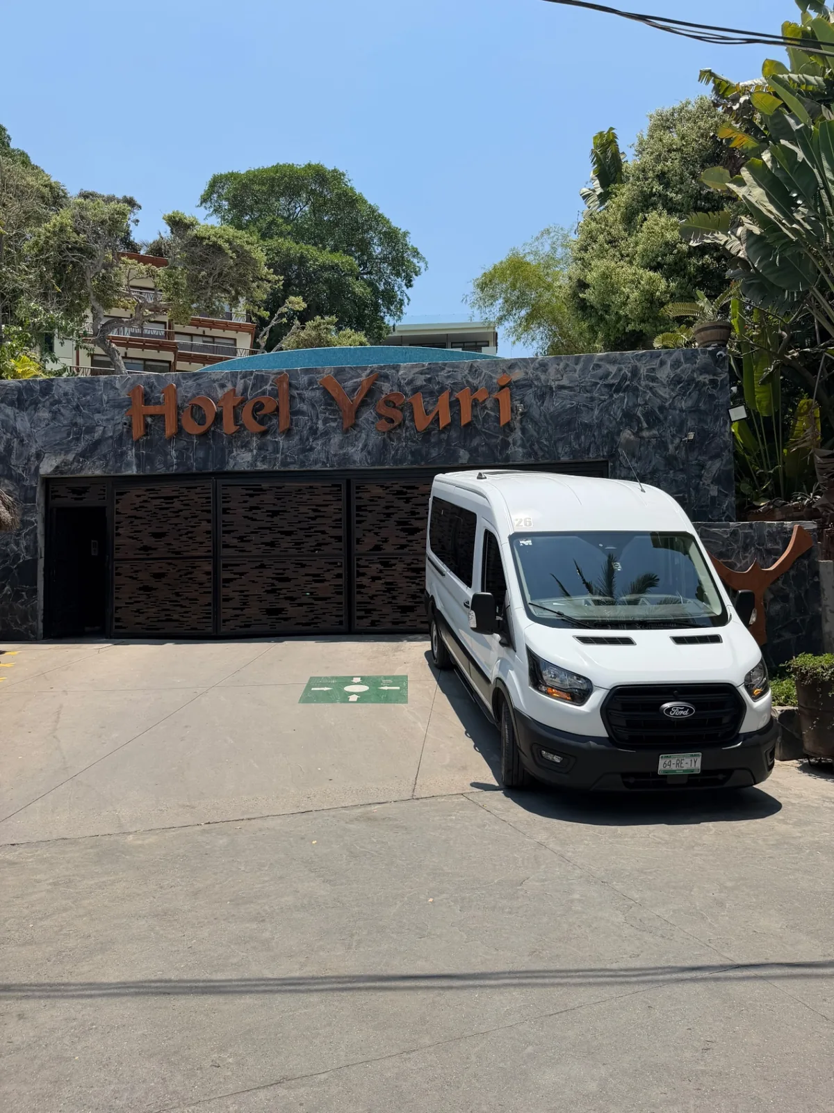 Private van waiting for guests outside Hotel Ysuri