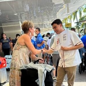 vallarta roots staf welcoming client to puerto vallarta airport pickup service